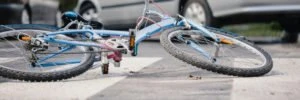 a blue bicycle lying on the road