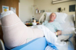 an elderly man in a leg cast