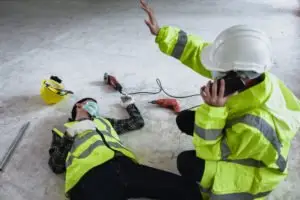 construction worker calling for help for an injured co-worker