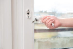 man holds a broken doorknob