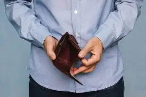 man-holding-an-empty-wallet