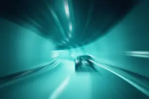 Abstract blurred tunnel vehicle driving at high speed.