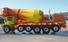 Yellow and orange mixing truck