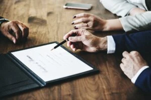 couple signing a divorce certificate