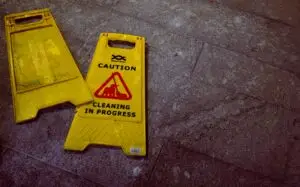 knocked over yellow wet floor sign