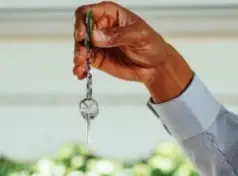 person handing over keys to a rental property