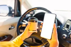 A distracted driver. A Boston distracted driving lawyer can help to ensure you get full and fair compensation.