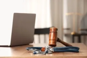 stethoscope and gavel with computer