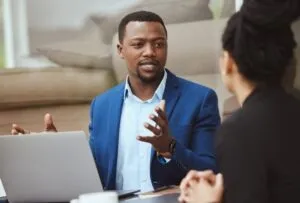 black lawyer talking to female client