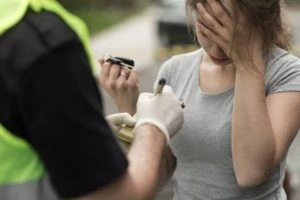 a drunk female driver getting cited by the police