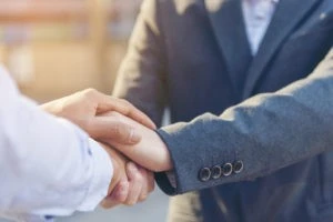 a lawyer shaking hands with a client