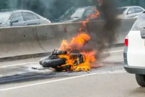 motorcycle on fire on the highway