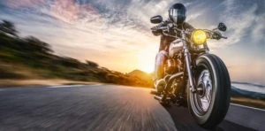 motorcyclist riding down the road