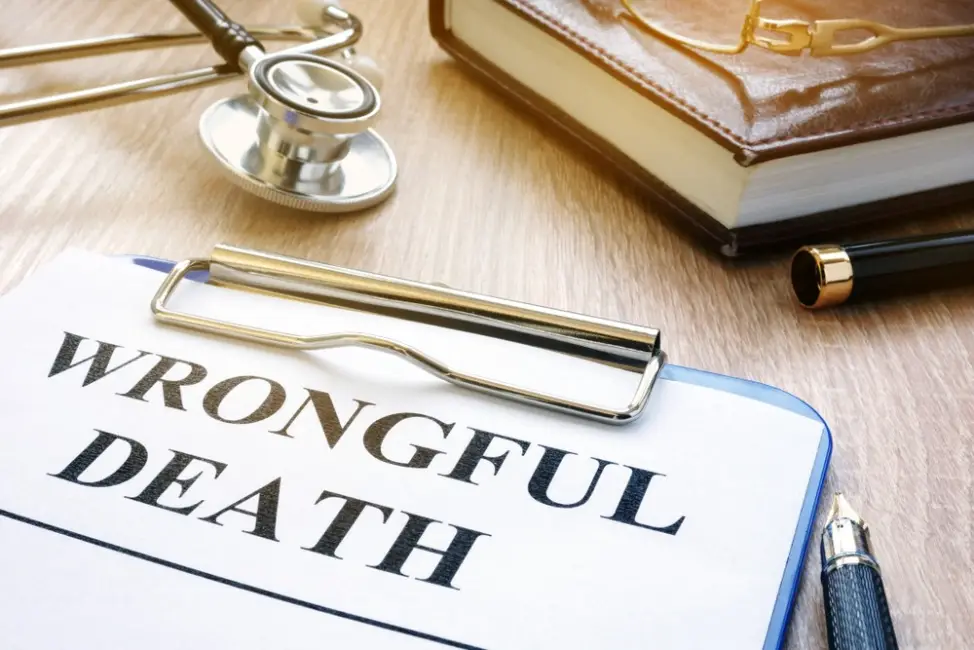 Wrongful death form and stethoscope on table