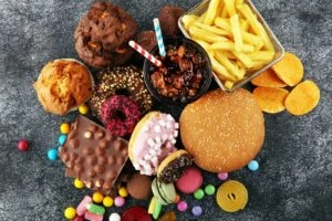 A pile of junk food representative of the types of products associated with ultra-processed foods lawsuits