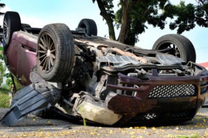 red car rolled over