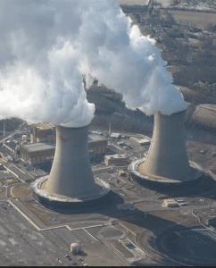 Two power station steam chimneys blowing a lot of steam out