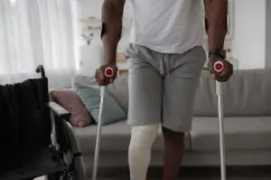 black man on crutches