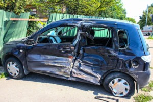 smashed-up black car