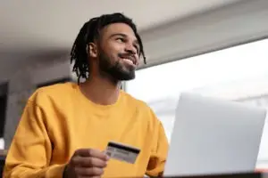 man happy to use debit card