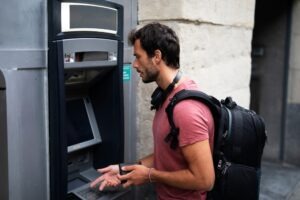 man getting cash from an ATM