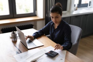 woman calculating her finances