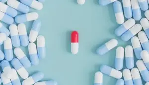 Capsule pills on blue background 2023 11 27 05 28 21 utc scaled