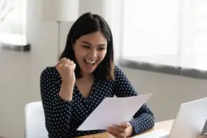 woman excited to see her loan was approved