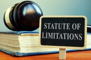 Gavel on a law book behind a sign that reads statute of limitations. Concept art for the question what is the statute of limitations for a personal injury claim in South Dakota.