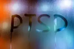 The acronym ‘PTSD’ is written on a foggy window. Can you get PTSD from a car accident in Florida?