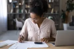 black woman using a calculator