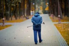 man with cane walking
