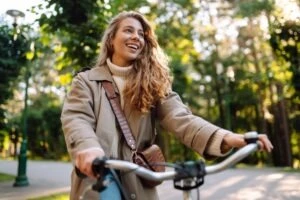 happy woman on a bicycle in pembroke pines