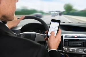 A man who is texting while driving in the state of Ohio