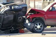 A truck colliding into another vehicle