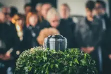 funeral proceeding with an urn
