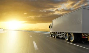 A truck driving on the road showing that we handle trucking accident lawsuits