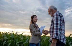 A man speaking with an insurance claims representative showing that we handle Farmers Insurance claims in Ohio