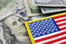 picture-of-an-american-flag-patch-over-a-stack-of-money