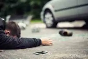 pedestrian lying on the street after an accident