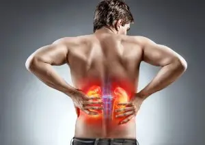 man experiences pain and discomfort in kidneys