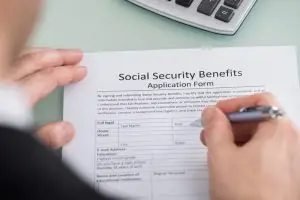 A man fills out a social security disability form.