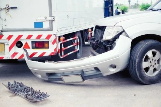 The aftermath of a passenger vehicle collision with a truck.