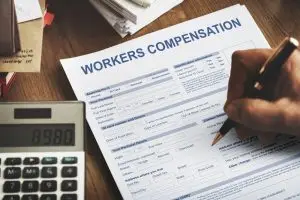 Calculating workers' compensation on a form.