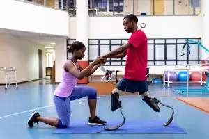 man with prosthetics doing physiotherapy