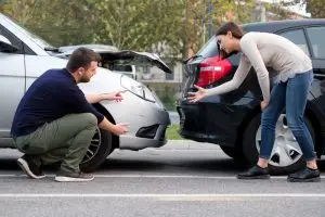 two people argue after car crash