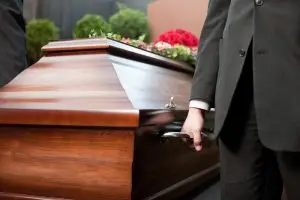 pallbearers with a casket