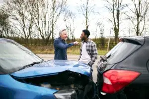 two men argue after car accident 