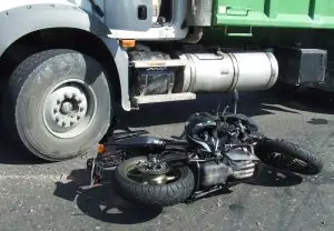 black motorcycle on asphalt after road accident