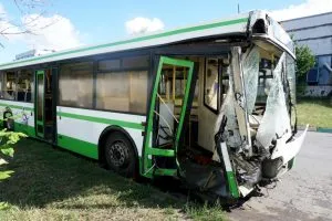 smashed-up green bus